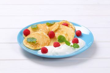 american pancakes with yogurt and raspberries