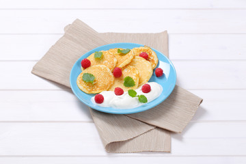 american pancakes with yogurt and raspberries