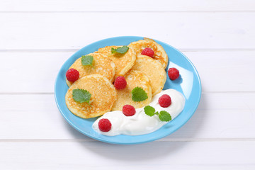american pancakes with yogurt and raspberries