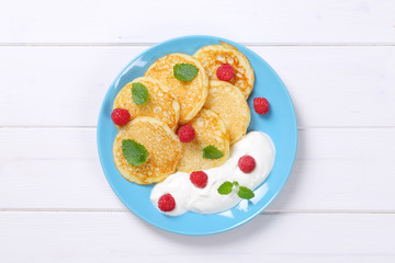 american pancakes with yogurt and raspberries