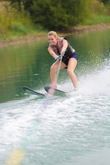 happy young girl on a water ski
