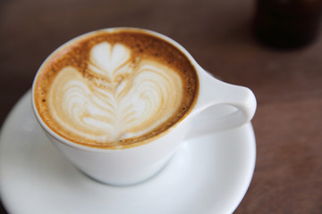 cappuccino coffee on wood background