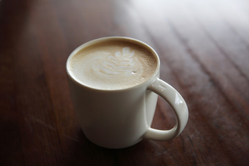 cappuccino coffee on wood background