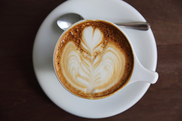 cappuccino coffee on wood background