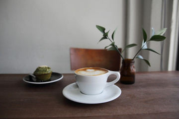 cappuccino coffee on wood background