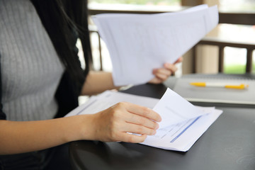 Office Woman hand Working on the Business Papers and tablet