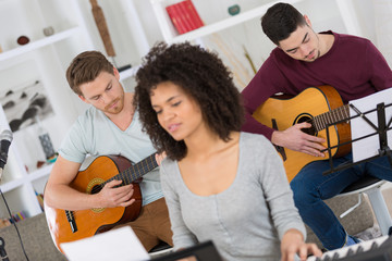 friends playing music indoors