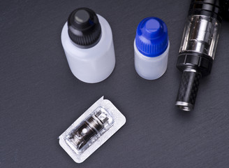 Naklejka premium modern vaporizer boxmod e-cig device on grey background