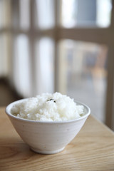 Rice on wood background