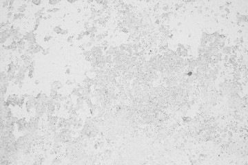 Old weathered facade with peeling white paint background