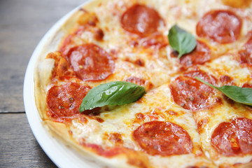 pepperoni pizza on wood