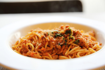 spaghetti bolognese meat sauce on wood