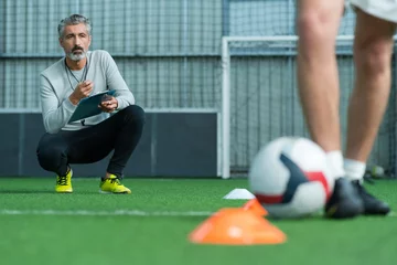 Foto op Plexiglas football coach training football player © auremar