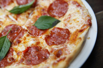 pepperoni pizza on wood