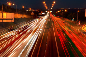 Fototapeta na wymiar Car lights on the night highway