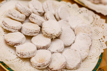 alfajores freshly baked cookies closeup on a plate on the table. horizontal