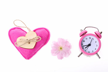 Pink toy heart, sakura flower and pink vintage alarm clock