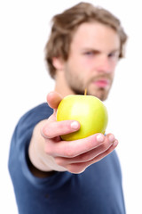 Apple of green colour in attractive caucasian mans hand
