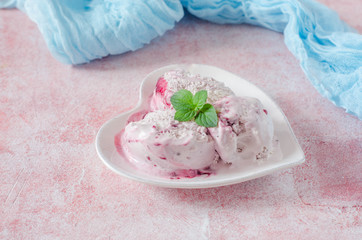 Homemade Strawberry ice cream in bowl shape heart on stone background. 