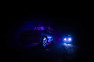 speed lighting of police car in the night on the road. Police cars on road moving with fog....