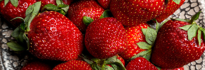background from fresh ripe useful fruit strawberry closeup, border design panoramic banner 
