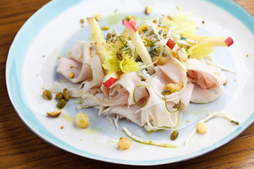 Light salad with turkey and apple. Healthy fitness food concept.