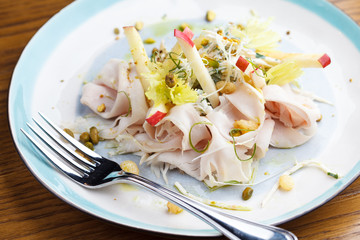 Light salad with turkey and apple. Healthy fitness food concept.
