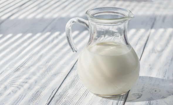 Glass pitcher of milk