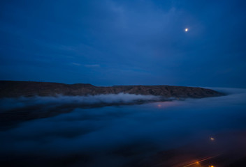 fog in the morning with mountain and moon at Baku, Azerbaijan