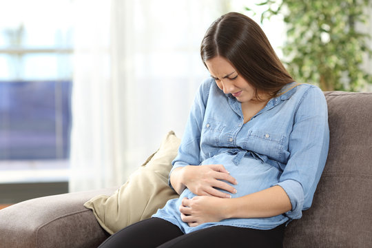 Pregnant woman suffering belly ache