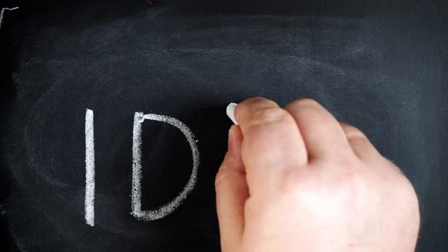 Male hand writing the word idea on chalkboard. Creativity concept 4K ProRes HQ codec