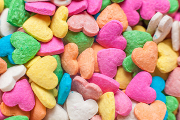 background of colorful heart shaped sweets