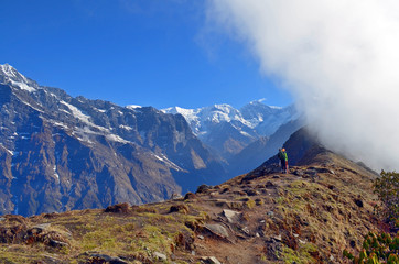 Two travelers in Mountain Landscape and cloud in Himalaya. Annapurna region, Nepal