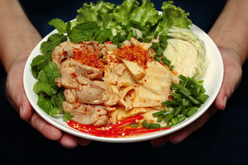 Spicy sour mixed vegetable salad with chicken and bamboo shoots.