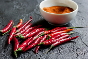 hot food with red chili pepper dark table background close up