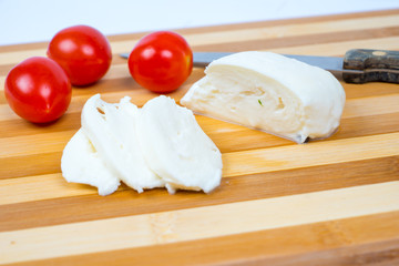 sliced mozzarella with tomatoes
