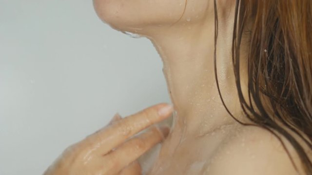 slow motion Closeup of Spa woman showering relaxing under running water in hot shower
