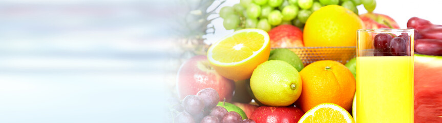 Orange juice on fruits background