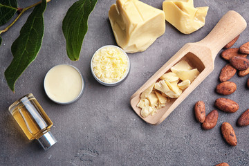 Beautiful composition with cocoa butter lotion and ingredients on table