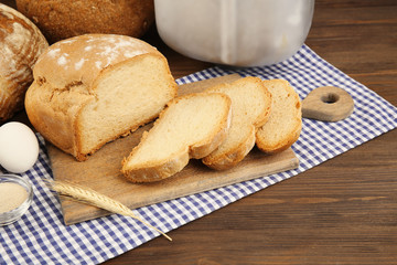Bread and ingredients on wooden table