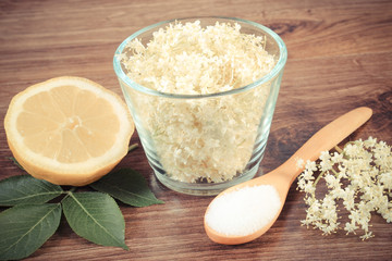 Vintage photo, Elderberry flowers and ingredients for preparing juice on board