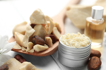Beautiful composition with cocoa butter products on table