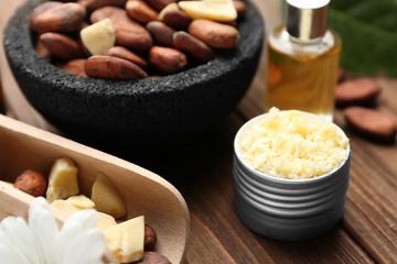 Beautiful composition with cocoa butter products on table