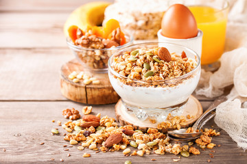 Muesli and yogurt in a glass on a table. Selective focus. Copy space for text