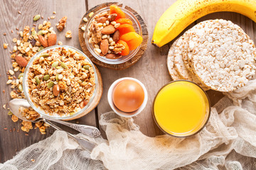 Muesli and yogurt in a glass on a table. Selective focus.Top view