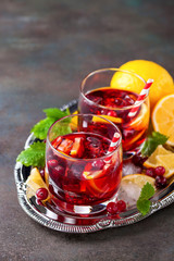 Drink with a lemon and a cranberry. Selective focus. Copy space