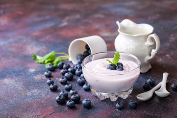 Yogurt with bilberry. Selective focus.