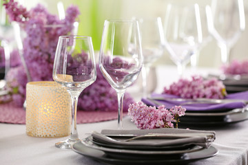 Beautiful table setting decorated with lilac blossom