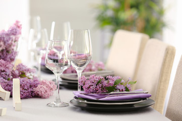 Beautiful table setting decorated with lilac blossom