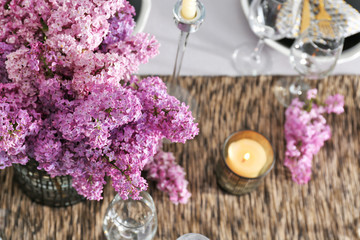 Beautiful table setting with lilac bouquet